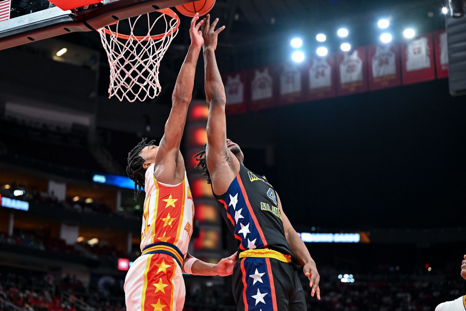 McDonald's All American West guard Isaiah Collier (4) shoots over McDonald's All American East guard D.J. Wagner (21) during the first half at Toyota Center.